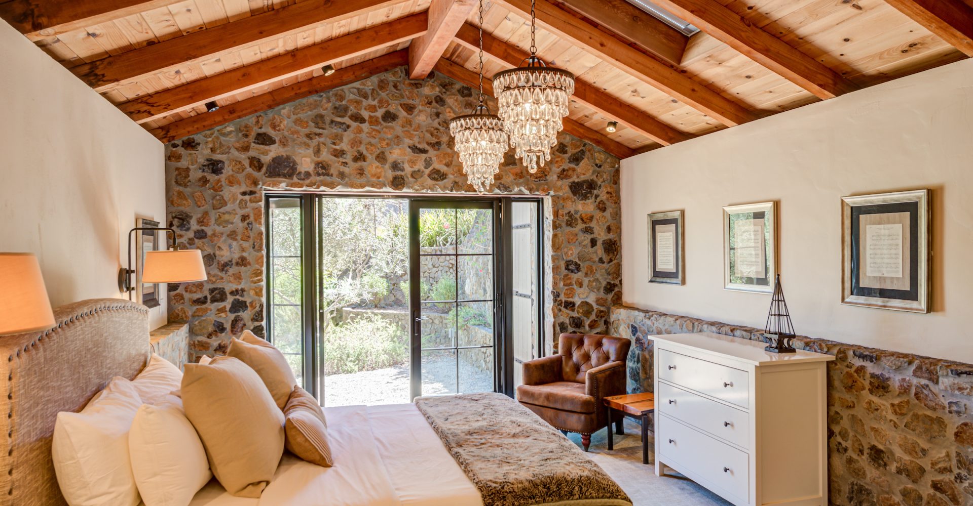 Bedroom remodel with wood beam ceiling and chandeliers by Sonoma County Home Builder LEFF Design Build.