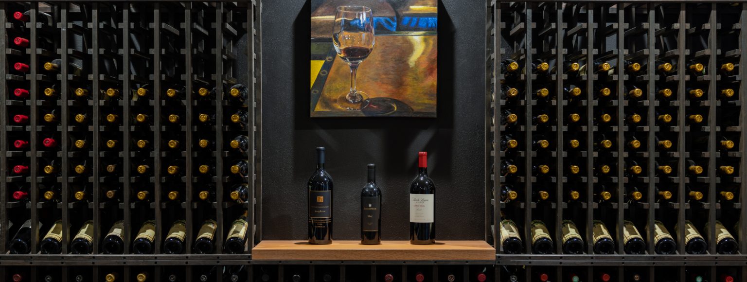 Custom wine rack storage in wine cellar remodel by Sonoma County's Premier Firm for Custom Homes + Remodeling LEFF Design Build.